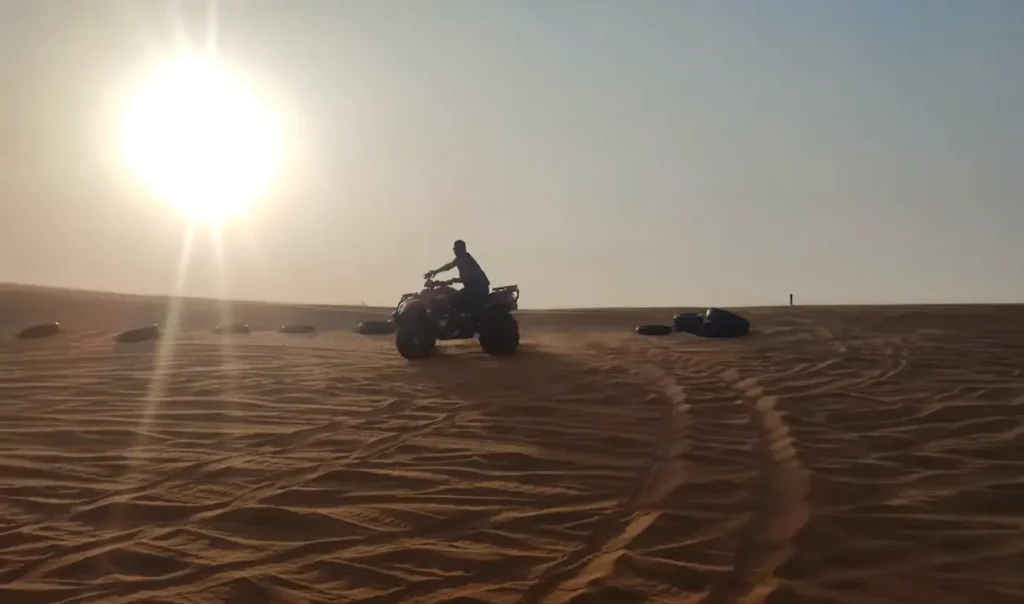 enjoying evening desert safari on quad bike